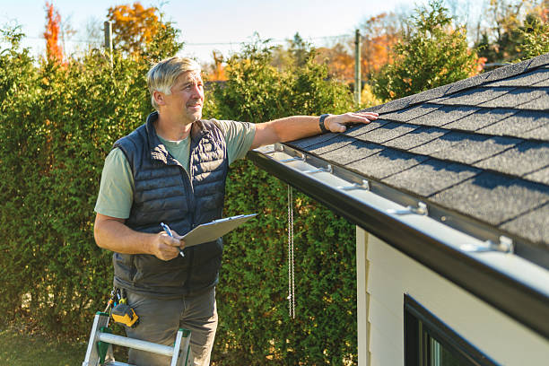 Professional Hail Damage Roof Repair technician working in Venice, IL